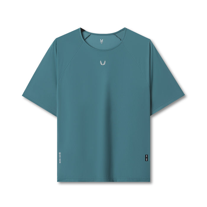 Flatlay of ASRV Ice-Skin™ Oversized Tee in storm blue, front view