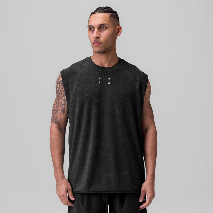 Black towel terry cutoff sleeveless tank on model, front view