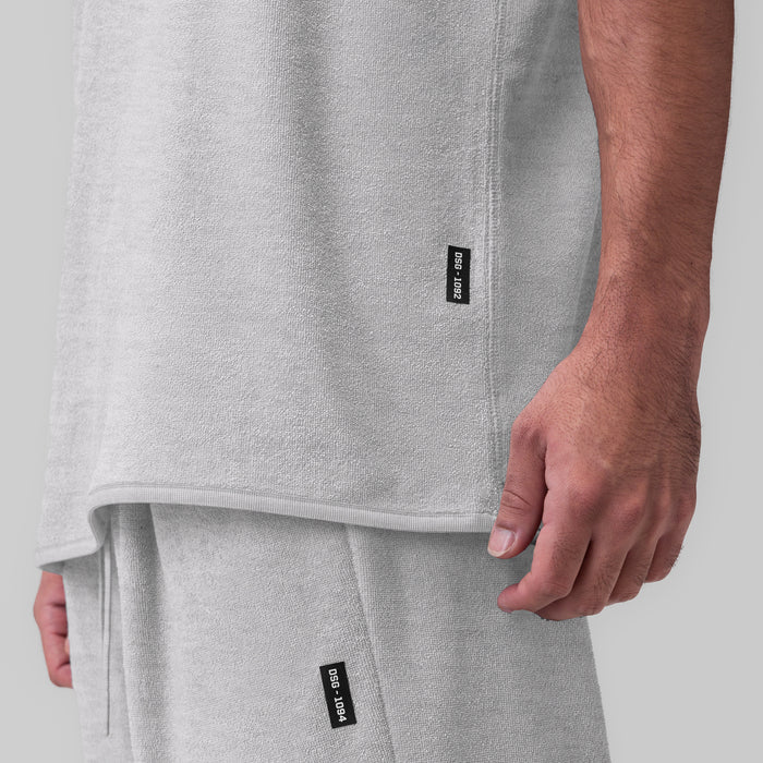 Towel Terry Cutoff in heather grey worn by model, side detail view showing fit