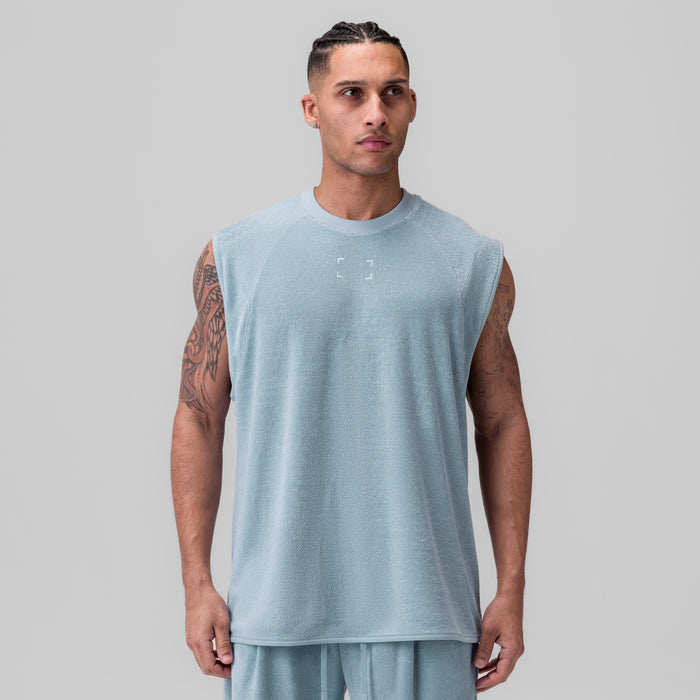 Towel Terry Cutoff sleeveless tank in light sky, worn by model facing forward