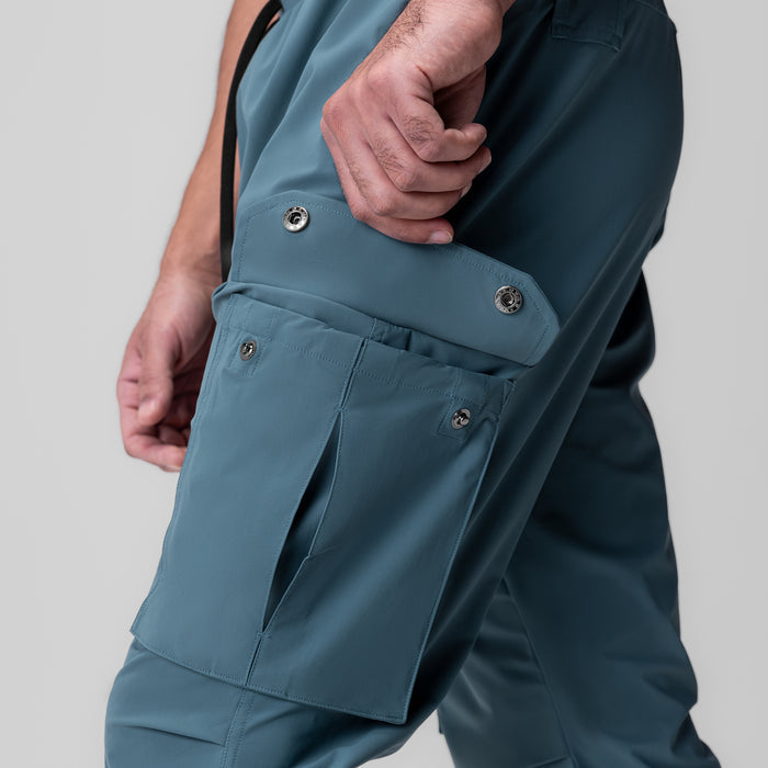 Tetra-Lite® Ice Cargo High Rib Jogger in storm blue, worn by model showing side cargo pocket detail