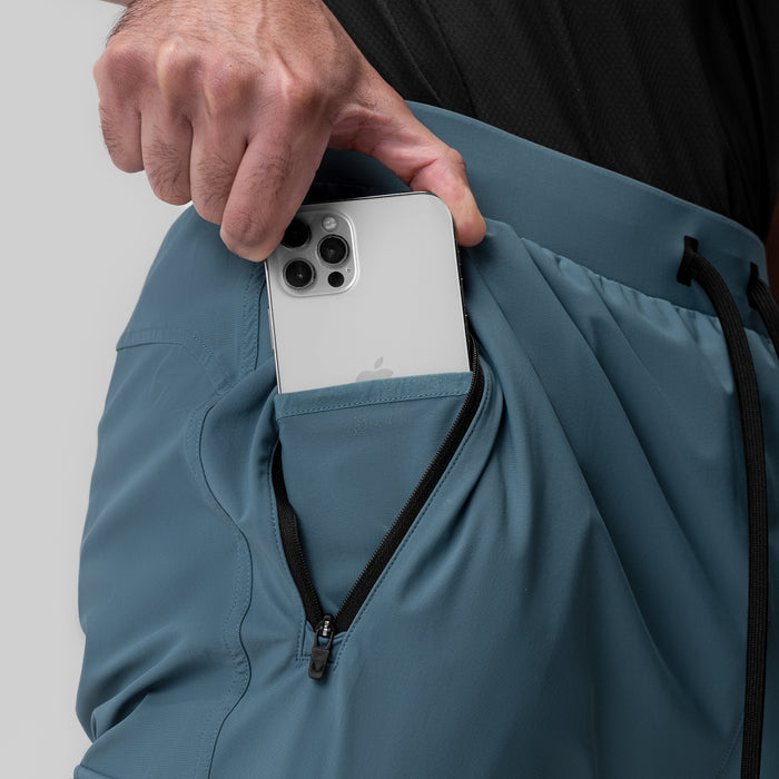 Tetra-Lite® Ice Cargo High Rib Jogger in Storm being held by model, showing pocket detail