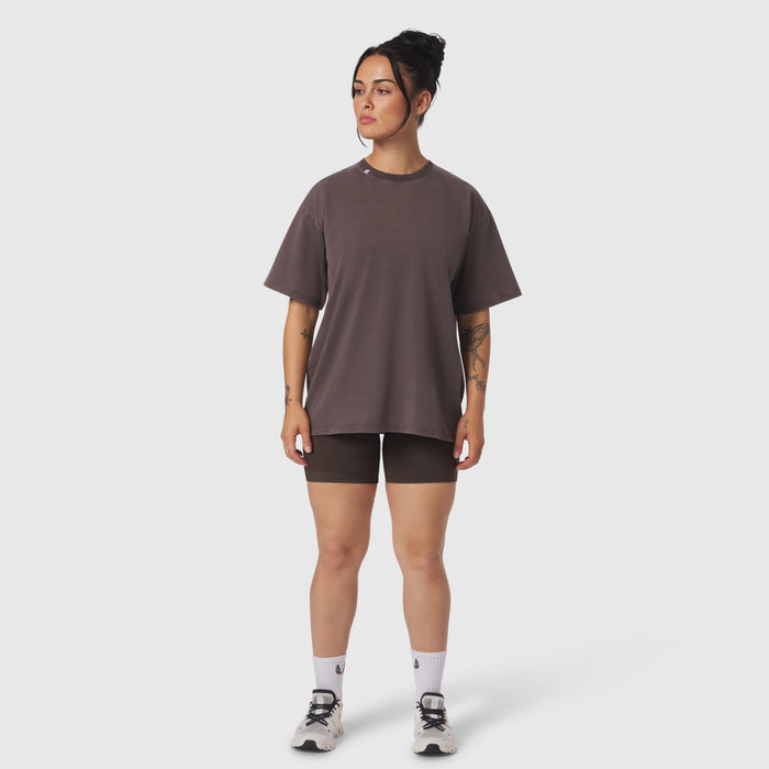 Distressed Relaxed Tee in dark earth worn with black shorts and white socks, front view on model