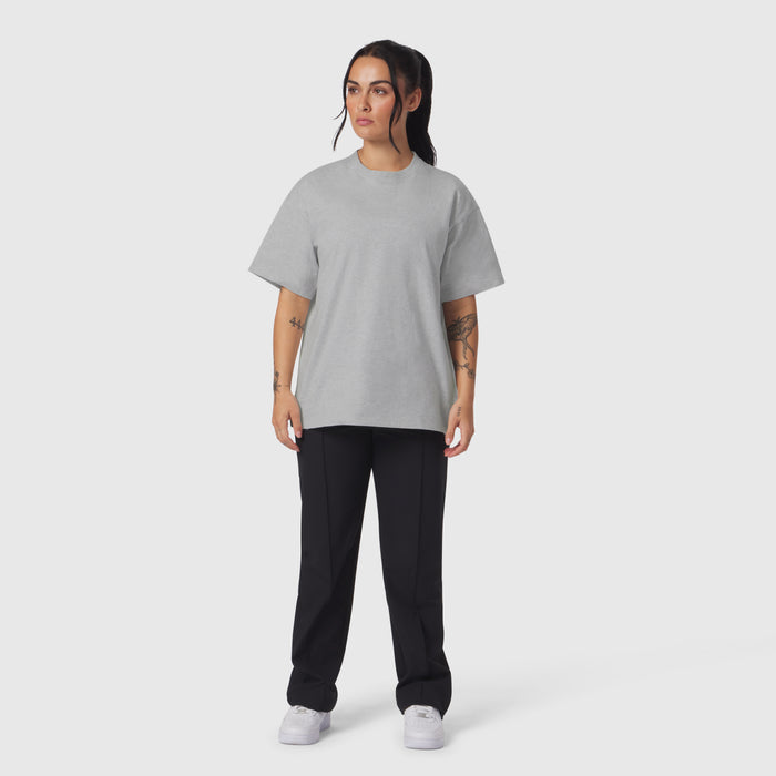 Heather grey relaxed tee worn with black joggers and white sneakers, front view