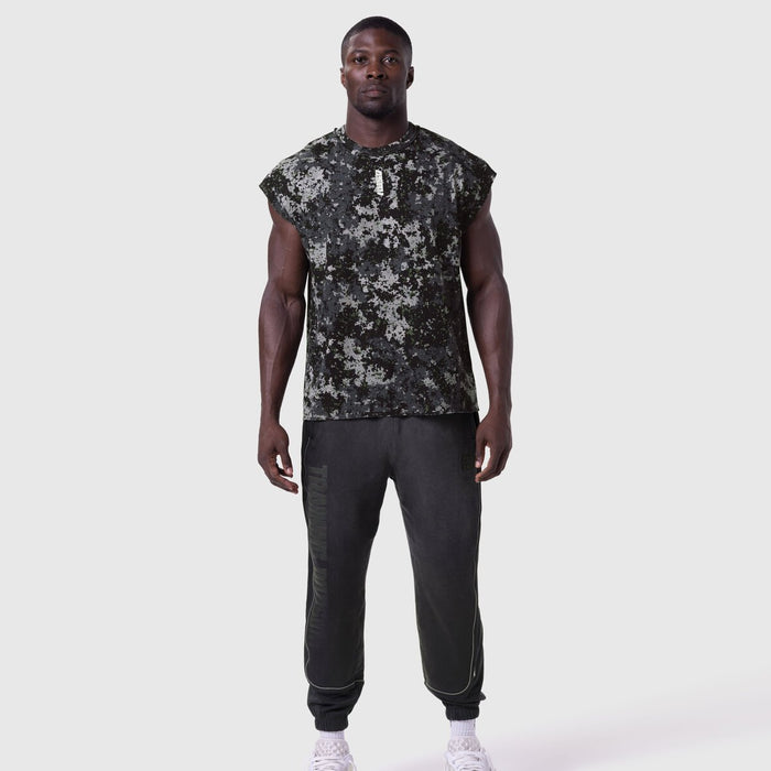 Tech Essential Cap Shoulder Cutoff in Pixel Camo worn with black joggers, front view