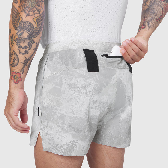Aerotex Distance Short in white camo, worn by model showing back view with drawstring detail