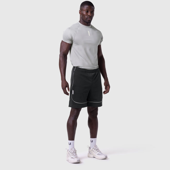 Ion-Mesh Modal Liner Short in black, worn by male model with grey t-shirt and white sneakers