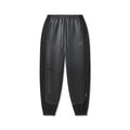 flatlay of black Tech-Terry Mesh Panel Sweats joggers with mesh side panels, front view
