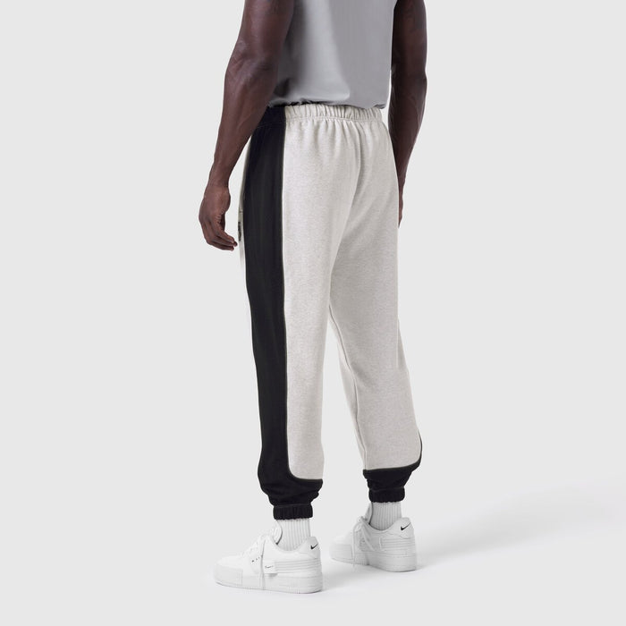 Tech-Terry Mesh Panel Sweats in heather grey and black, worn from behind on model