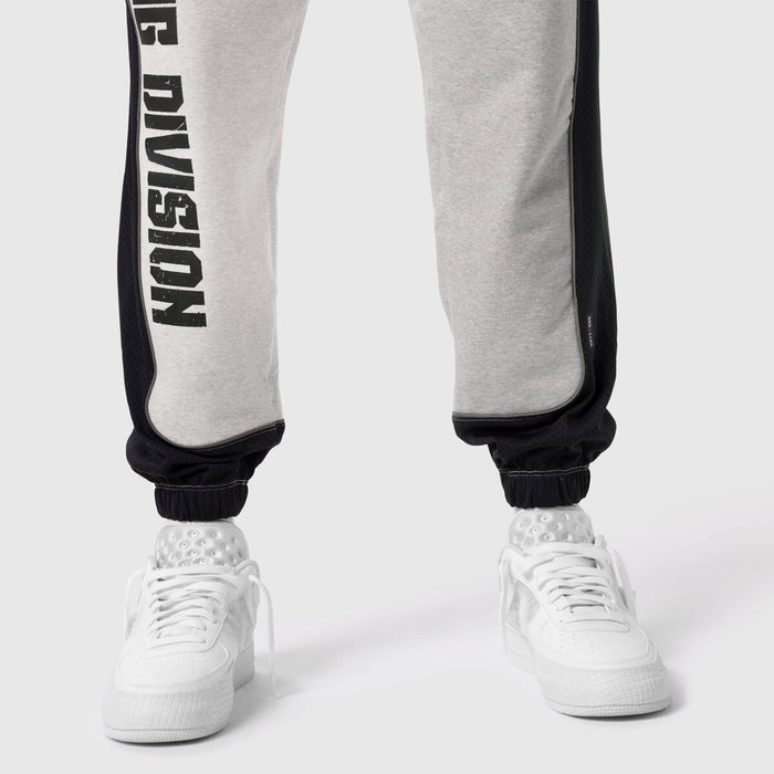 Tech-Terry Mesh Panel Sweats in heather grey and black worn with white sneakers, lower body view