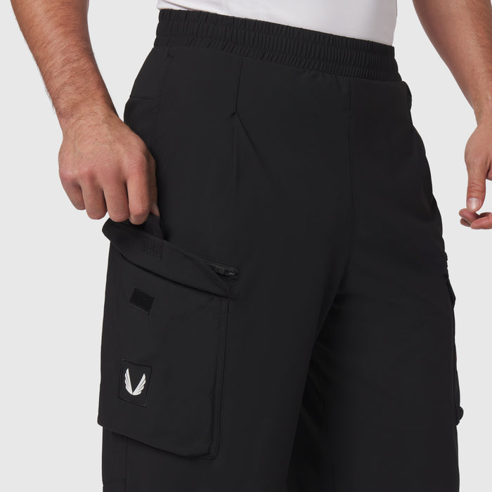 Tetra-Lite® Cargo City Pant in black worn by model, side view showing cargo pocket detail