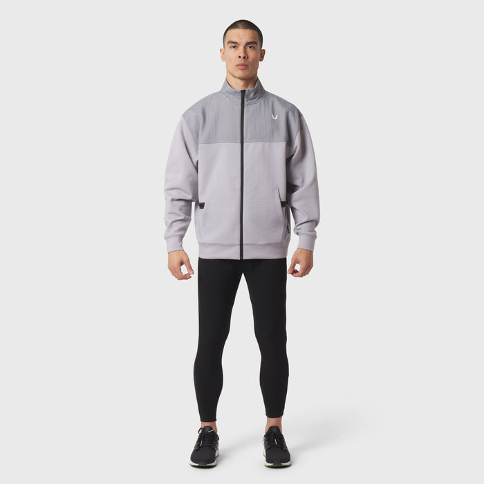 Dri-Core Sidelock Full Zip in slate grey, worn by model with black leggings, front view