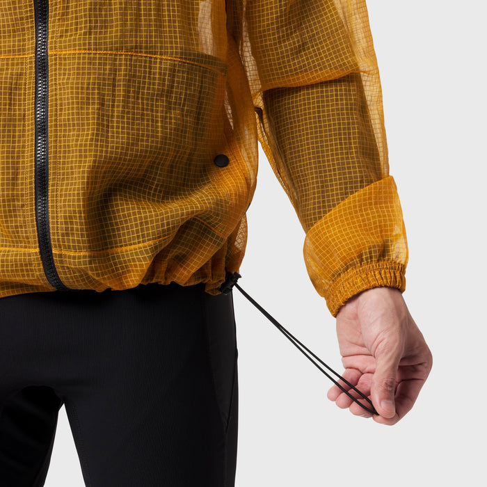 Weather-Ready Transparent Ripstop Shell Jacket in amber, worn by model showing drawcord detail