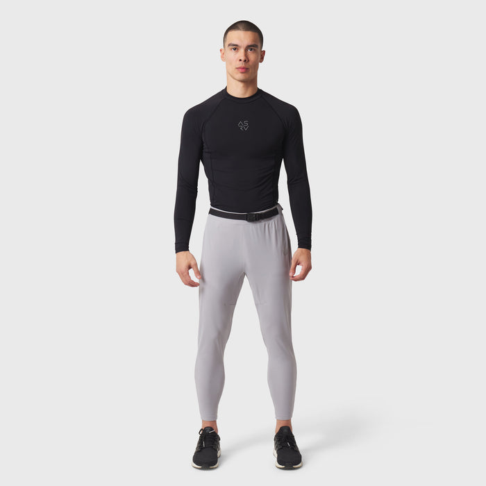 Black LYCRA® ADAPTIV baselayer longsleeve with grey leggings, front view on model