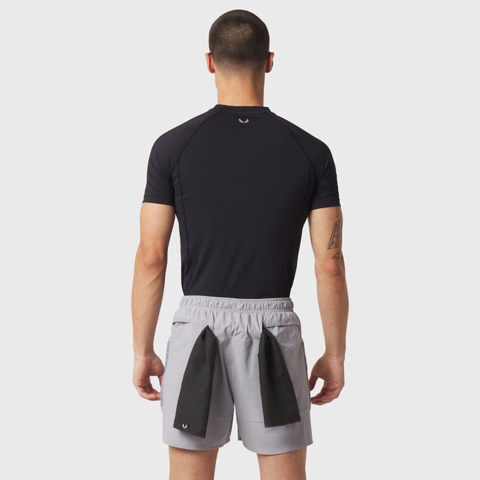 LYCRA® ADAPTIV Baselayer Shortsleeve in black, worn by model from back view