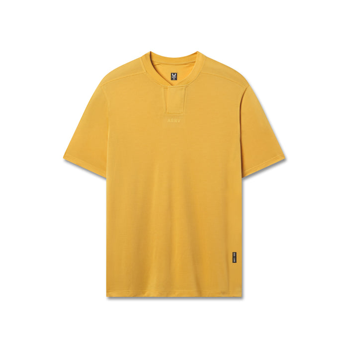 Polartec® Delta Polo in amber yellow, front view on invisible model flatlay