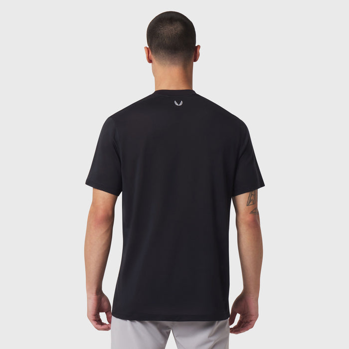Black short-sleeve polo shirt worn by model, back view