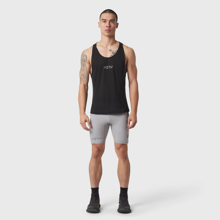 Black Polartec® Delta Singlet worn by model with grey shorts, front view