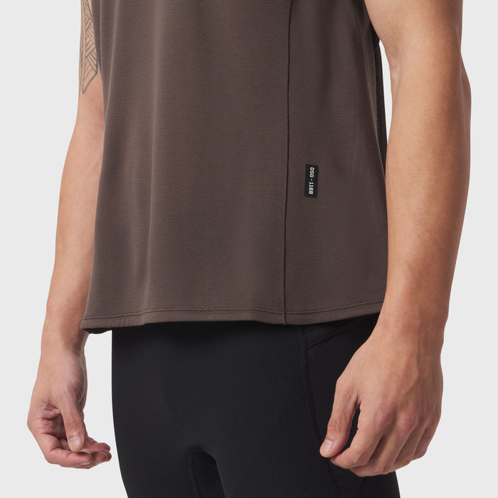 Polartec® Delta Singlet in dark earth, worn by model showing side view