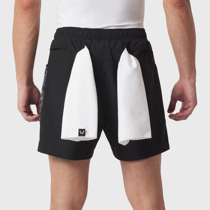 Tetra-Lite Adventure Short in black with white side panels, worn by model, back view