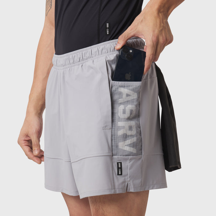 Tetra-Lite Adventure Short in Slate Grey worn by model, demonstrating side pocket with phone