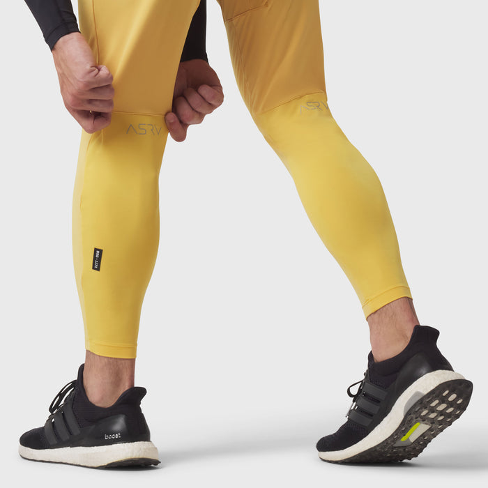 Hybrid Belt-Pack Run Jogger in amber yellow, worn by model jogging in place with black sneakers