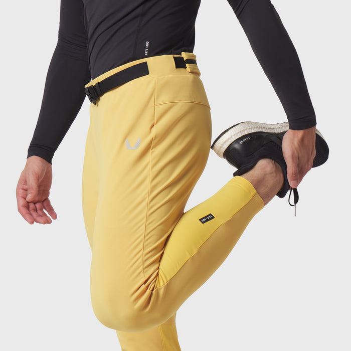 Hybrid Belt-Pack Run Jogger in amber yellow worn by model, side view with belt detail