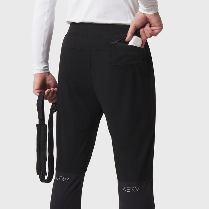 Black hybrid belt-pack run jogger worn by model, showing side pocket and belt pack detail