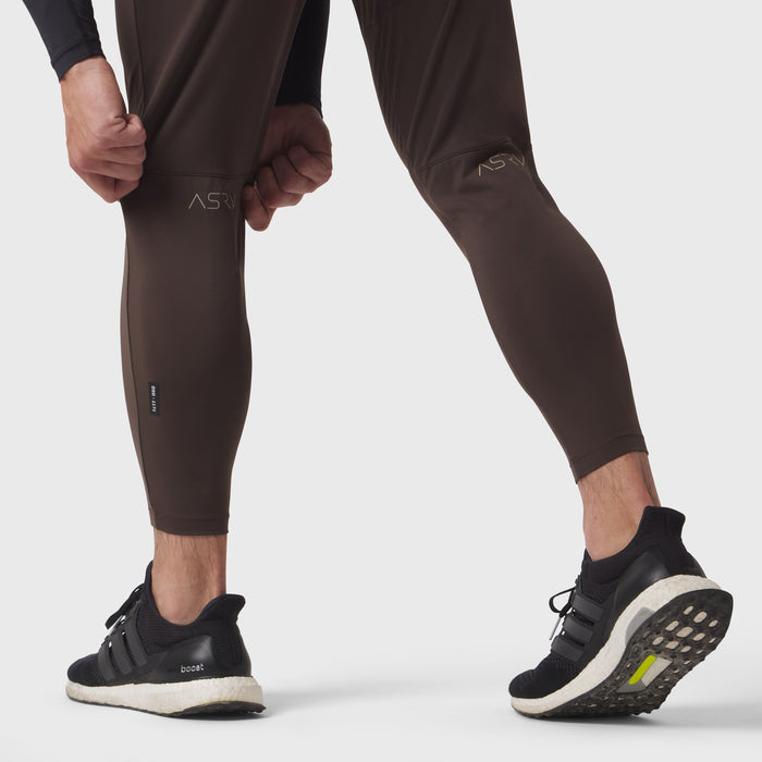 Hybrid Belt-Pack Run Jogger in dark earth brown, worn by model running, side view