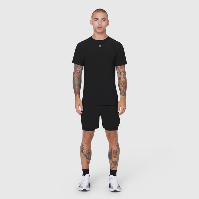 Black Laser-Vent Training Tee worn with black shorts, front view on model