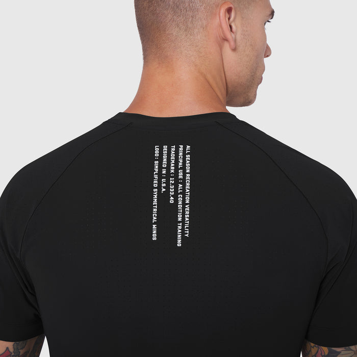 Black Laser-Vent Training Tee worn by model, back view showing text graphic