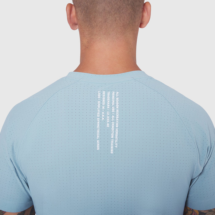 Light Sky Laser-Vent Training Tee worn by model, back view showing perforated fabric detail