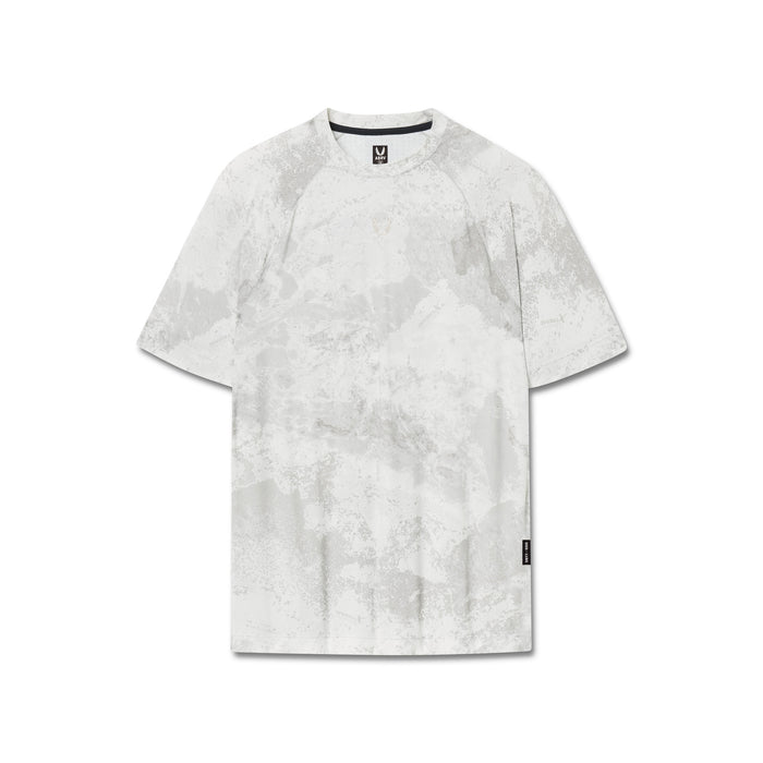 flatlay Laser-Vent Training Tee in white marble, front view