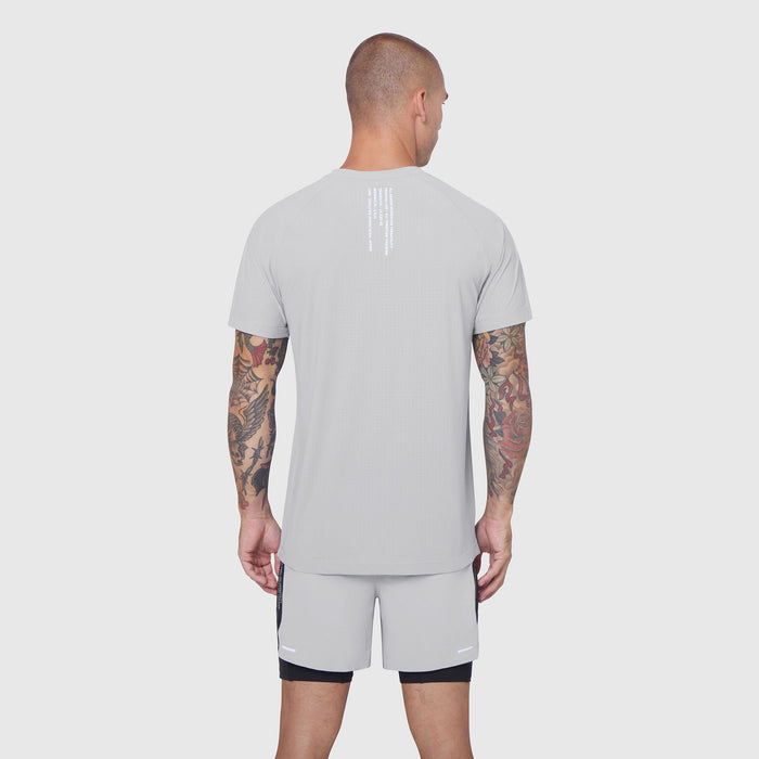 Laser-Vent Training Tee in slate grey, back view on model with tattoos
