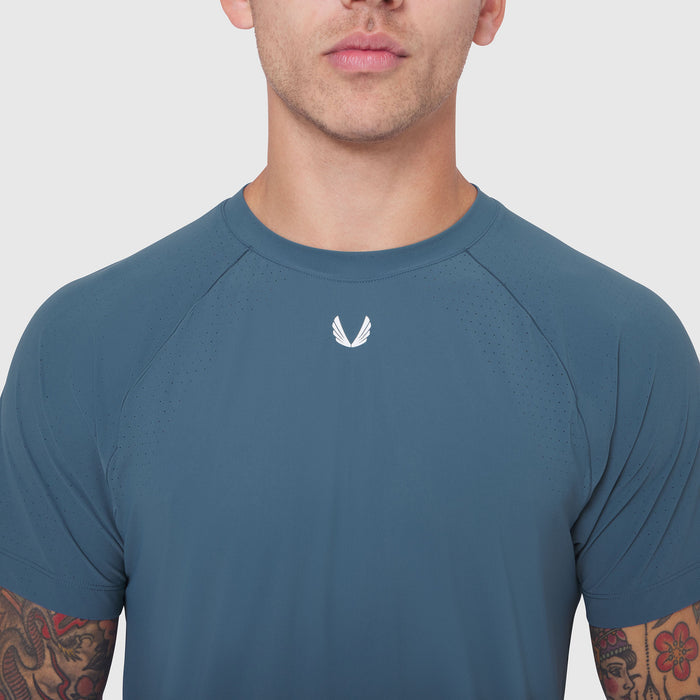Laser-Vent Training Tee in storm blue worn by male model, front view