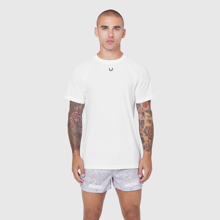 White Laser-Vent Training Tee worn by male model with lavender shorts, front view
