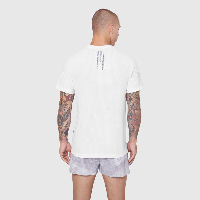 White Laser-Vent Training Tee worn by model from back view, showing textured fabric and rear design detail