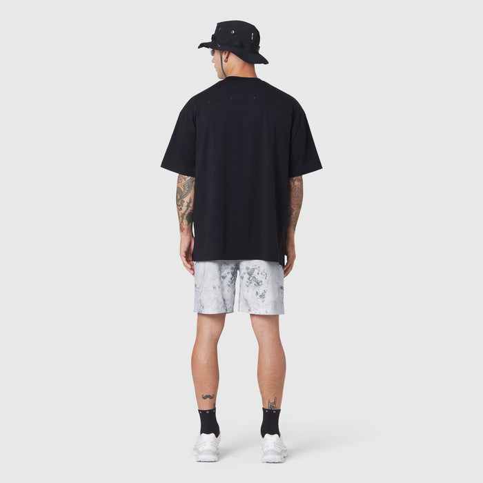 Black SUPIMA® Ice-Skin™ Reversible Tee worn with light tie-dye shorts, back view