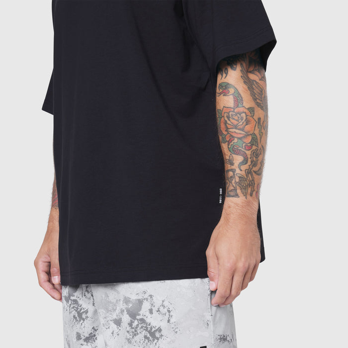 Black Supima Ice-Skin reversible tee on model, side view showing sleeve and fit