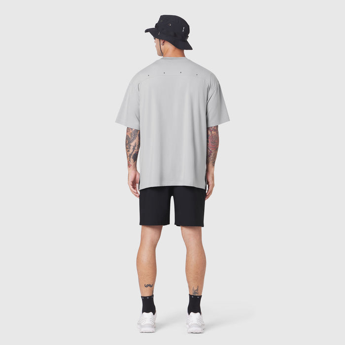 Supima Ice-Skin Reversible Tee in slate grey worn by model from back, paired with black shorts