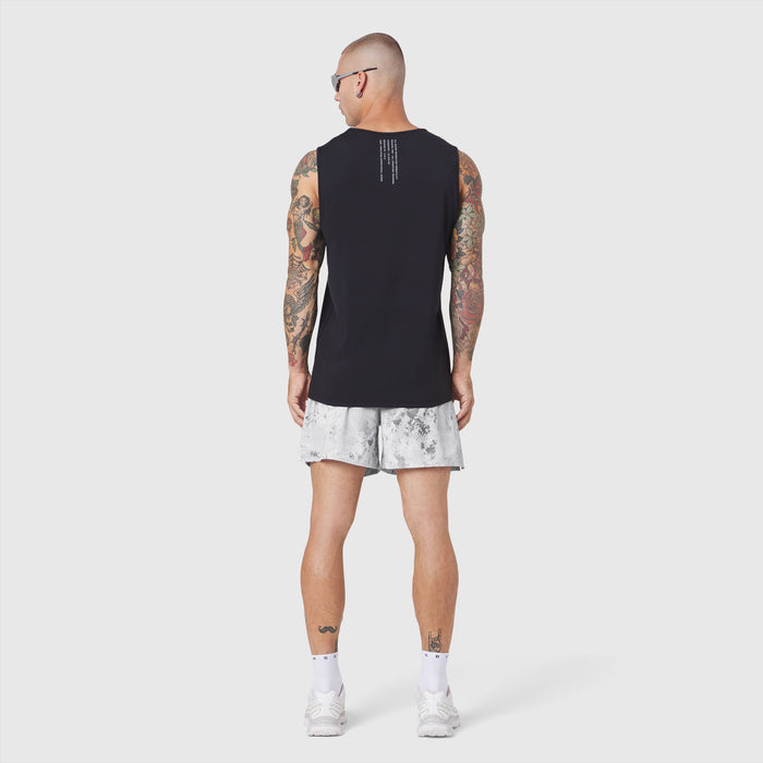Black Warpflexx-Lite Training Tank worn with white shorts, back view on model