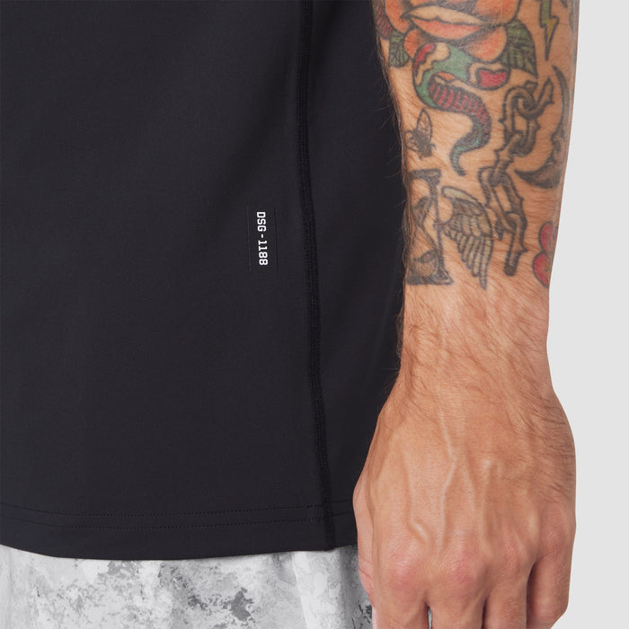Warpflexx-Lite® Training Tank in black, worn by model showing side view with tattooed arm