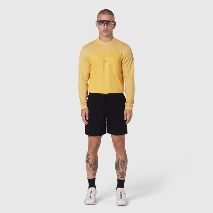 AEROSILVER® UPF50+ Run Long Sleeve in amber worn with black shorts, front view