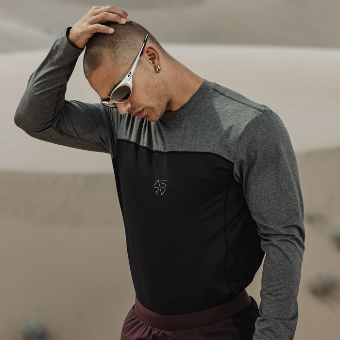 AEROSILVER UPF50+ Run Long Sleeve in black and gray colorblock, worn by model outdoors