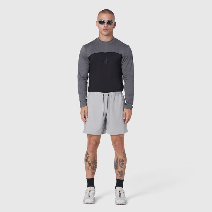 AEROSILVER® UPF50+ Run Long Sleeve in black and grey, modeled with light grey shorts, front view