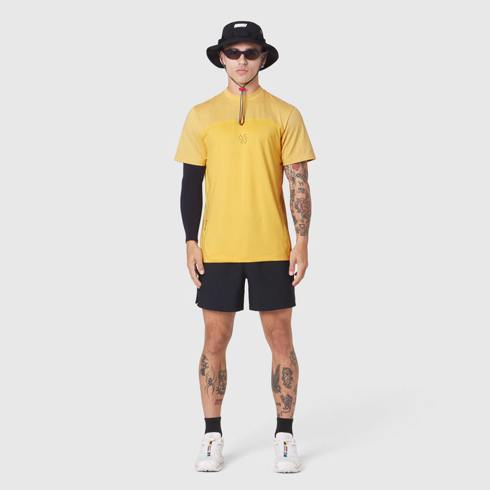 AEROSILVER® UPF50+ Run Tee in amber yellow worn by model with black shorts, front view