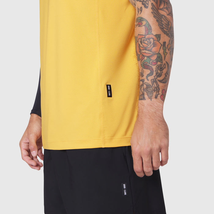 AEROSILVER UPF50+ Run Tee in amber yellow worn by model, side view