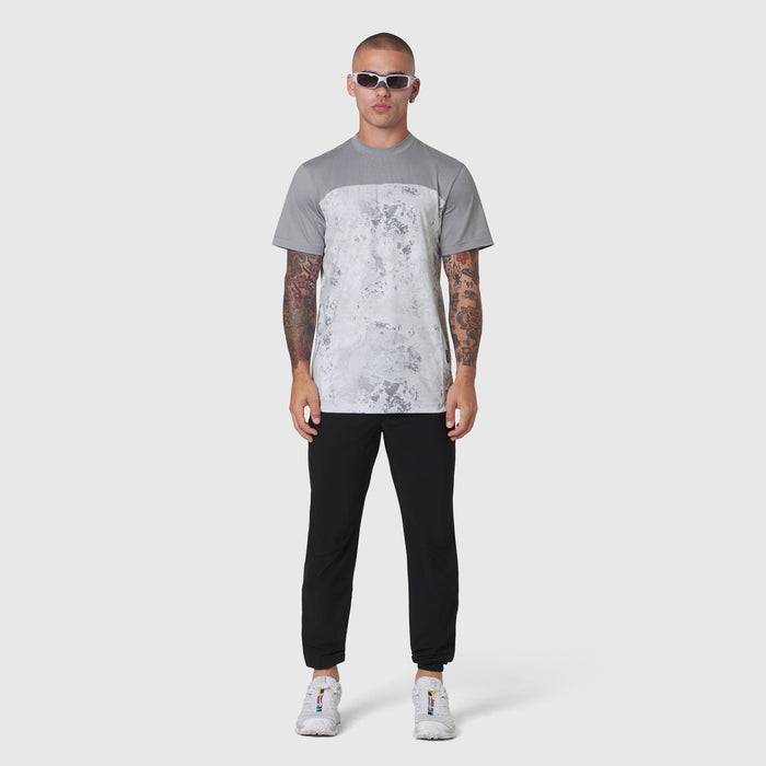 AEROSILVER® UPF50+ Run Tee in Sedona Snow Camo worn by model with black joggers
