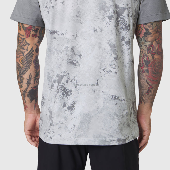 AEROSILVER® UPF50+ Run Tee in Sedona Snow Camo worn by model showing back view with tattooed arms
