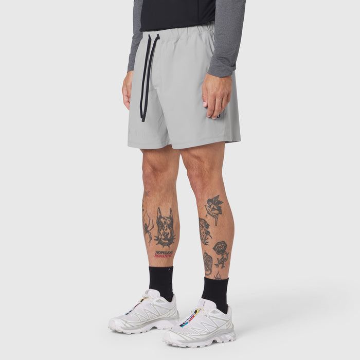 Revolutional Training Short in slate grey worn by model, side view